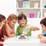 kids rejoice at the result of the experiment with soda and vinegar