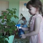 Girl with a watering can